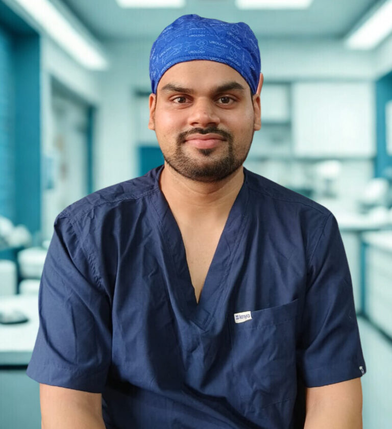 Dr. Ojas Potdar, in navy blue scrubs